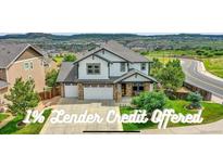 Beautiful two-story home boasts a two-car garage, manicured lawn, and attractive landscaping at 2314 Fairway Wood Cir, Castle Rock, CO 80109