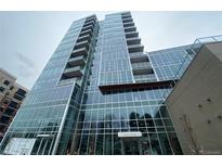 Stunning high-rise building with sleek glass facade and multiple balconies offering city views at 4200 W 17Th Ave # 411, Denver, CO 80204