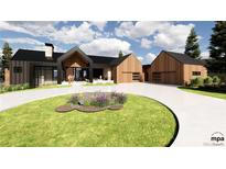 Modern farmhouse exterior boasts a metal roof, expansive windows, and a spacious driveway at 11168 Wild Chase Pl, Franktown, CO 80116