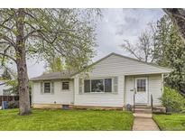 Charming one-story home with green trim, grassy lawn, and a sidewalk leading to the front door at 5370 S Sherman St, Littleton, CO 80121