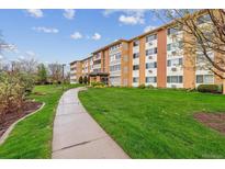 Inviting multi-story condo with charming exterior details and well-maintained landscaping at 795 S Alton Way # 5D, Denver, CO 80247