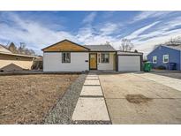 Cute bungalow with modern exterior and landscaped front yard at 2360 S Julian St, Denver, CO 80219