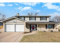 Charming two-story home with brick accents, a two-car garage, and a well-maintained front yard at 3257 S Geneva St, Denver, CO 80231