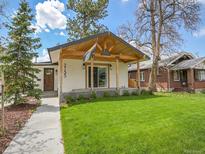 Charming renovated home features a modern porch, inviting entryway and a well-maintained lawn at 2155 S Emerson St, Denver, CO 80210