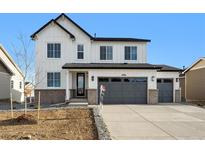 New construction two-story home featuring a three-car garage and modern farmhouse design at 6986 E 126Th Pl, Thornton, CO 80602