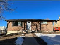 Brick exterior of a single-story home with a well-maintained front yard at 1245 Yates St, Denver, CO 80204