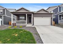 Charming home with a well-maintained front yard and a two-car garage, plus a cozy porch at 2226 Monte Vista St, Fort Lupton, CO 80621
