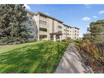 Attractive building exterior with landscaping and walkway at 595 S Alton Way # 5D, Denver, CO 80247