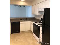 Well-lit kitchen featuring white cabinets, black appliances, and an open layout at 2355 E Geddes Ave # G24, Centennial, CO 80122