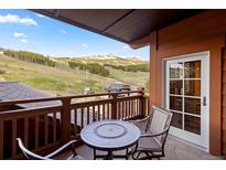 Inviting balcony features mountain views, table and chairs, perfect for enjoying the outdoors at 1521 Ski Hill Rd # 8313, Breckenridge, CO 80424