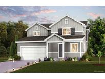 Charming two-story home with a well-manicured lawn and classic architectural details at 12354 E 101St Dr, Commerce City, CO 80022