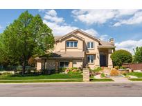 Charming two-story home with landscaped front yard and inviting entrance at 5773 S Benton Way, Littleton, CO 80123