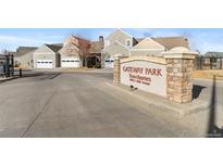 Gateway Park townhome community entrance with stone signage and well-maintained landscaping at 15555 E 40Th Ave # 11, Denver, CO 80239
