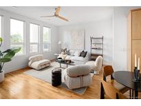 Open concept living area boasting hardwood floors, neutral tones, and modern furnishings at 340 S Lafayette St # 201, Denver, CO 80209