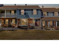 Charming townhome with a combination brick and siding facade and front yard at 2540 E Geddes Pl, Centennial, CO 80122