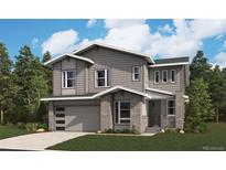 Charming two-story home with gray siding, a brick facade, and an attached two-car garage at 24950 E 42Nd Ave, Aurora, CO 80019