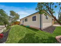 Charming home featuring a well-maintained lawn and classic architecture at 4640 W Ellsworth Ave, Denver, CO 80219