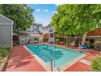 Backyard pool with brick patio, great for relaxing and entertaining with lush landscaping at 1111 Maxwell Ave # 228, Boulder, CO 80304