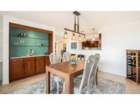 Open dining room features a built-in bar and modern light fixture, perfect for entertaining guests at 1029 E 8Th Ave # 1302, Denver, CO 80218