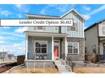 Charming two-story home with stone accents and a welcoming front porch at 21209 E 62Nd Ave, Aurora, CO 80019