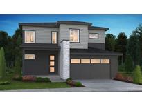 Modern two-story home featuring a two-car garage and landscaped front yard at 1300 Stillspring Ln, Castle Pines, CO 80108