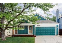 Charming home featuring a lovely porch, two-car garage, and lush green lawn at 7680 Elmwood St, Littleton, CO 80125