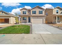 Charming two-story home with a well-maintained lawn and inviting curb appeal at 18813 E 99Th Ave, Commerce City, CO 80022