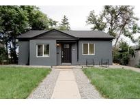 Charming single-story home with a well-maintained front yard and a walkway leading to the front door at 1361 W Custer Pl, Denver, CO 80223