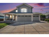 Charming two-story home featuring a two-car garage and covered porch entrance at 6833 E 115Th Ave, Thornton, CO 80233