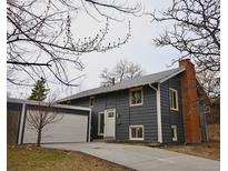 Charming two-story home with a brick chimney and a two car garage at 2300 S Krameria St, Denver, CO 80222