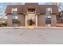 Attractive building exterior, featuring a classic design and landscaping at 7755 E Quincy Ave # 101, Denver, CO 80237