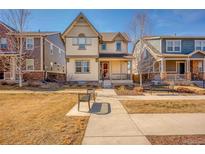 Charming two-story home featuring a covered front porch and neat landscaping at 540 E Fremont Pl, Centennial, CO 80122