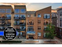 Beautiful condominium complex with balconies, showcasing an offer of three months paid HOA dues at 7240 W Custer Ave # 303, Lakewood, CO 80226
