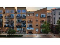 Exterior view of the Lofts building showing brick facade, windows and balconies at 7240 W Custer Ave # 303, Lakewood, CO 80226
