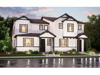 A modern two-story home featuring white siding, black trim, and manicured landscaping, captured at dusk at 14077 Deertrack Ln, Parker, CO 80134