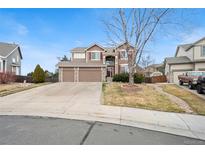 Charming two-story home with a well-manicured front yard and two-car garage, perfect for suburban living at 132 Mesa St, Brighton, CO 80601