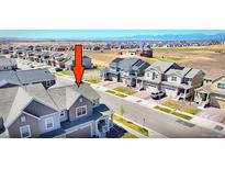 Beautiful home in suburban neighborhood with mountain views on a sunny day at 700 Lillibrook Pl, Erie, CO 80026