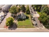 Charming home with well-maintained lawn, mature trees, and convenient street parking at 6280 W 38Th Ave, Wheat Ridge, CO 80033