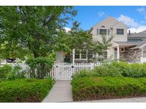 Charming home featuring a well-manicured front yard and a classic white picket fence at 4945 Prebles Pl, Broomfield, CO 80023
