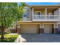 Inviting townhome with two-car garage and charming second story balcony at 12925 Grant Cir # A, Thornton, CO 80241
