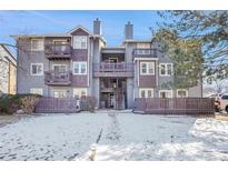 Inviting condo exterior featuring a well-maintained lawn, mature trees, and a charming facade at 7891 Allison Way # 201, Arvada, CO 80005