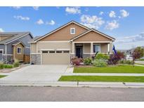 Charming single-Gathering home with a two-car garage and well-maintained landscaping at 15524 E 115Th Ave, Commerce City, CO 80022