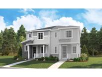 Charming home with a well-manicured lawn, complemented by siding and stone trim at 1228 Penner Dr, Erie, CO 80026