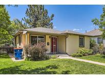 Charming single-story home featuring a well-manicured lawn and a welcoming red front door at 4111 S Delaware St, Englewood, CO 80110