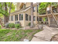 Charming condo building with a private entrance and mature landscaping at 4882 E Kentucky Ave # A, Denver, CO 80246