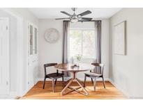 Charming dining space with modern lighting, built-in cabinet, and cozy seating at 5190 E Asbury Ave, Denver, CO 80222