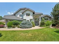 Charming home showcasing lush landscaping and a well-maintained lawn, enhancing curb appeal at 2247 Eagles Nest Dr, Lafayette, CO 80026