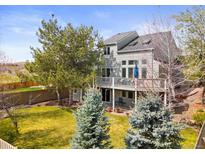 Charming home featuring a spacious backyard, mature trees, a deck, and a walkout basement at 2545 Andrew Dr, Superior, CO 80027