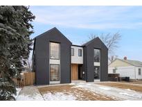 Striking modern home featuring a black and white facade and large windows at 2961 S Cherokee St, Englewood, CO 80110