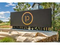 Painted Prairie community entrance sign on a stone base at 20590 E 58Th Ave, Aurora, CO 80019
